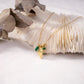 Necklace with leaf pendant and pearl in gold color