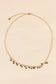Necklace with mini golden green pendants