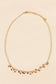 Necklace with mini gold black pendants