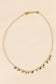 Necklace with mini gold black pendants