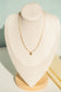 Collier perle avec pendentif rond