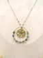 Long necklace with round pendant and green pearls